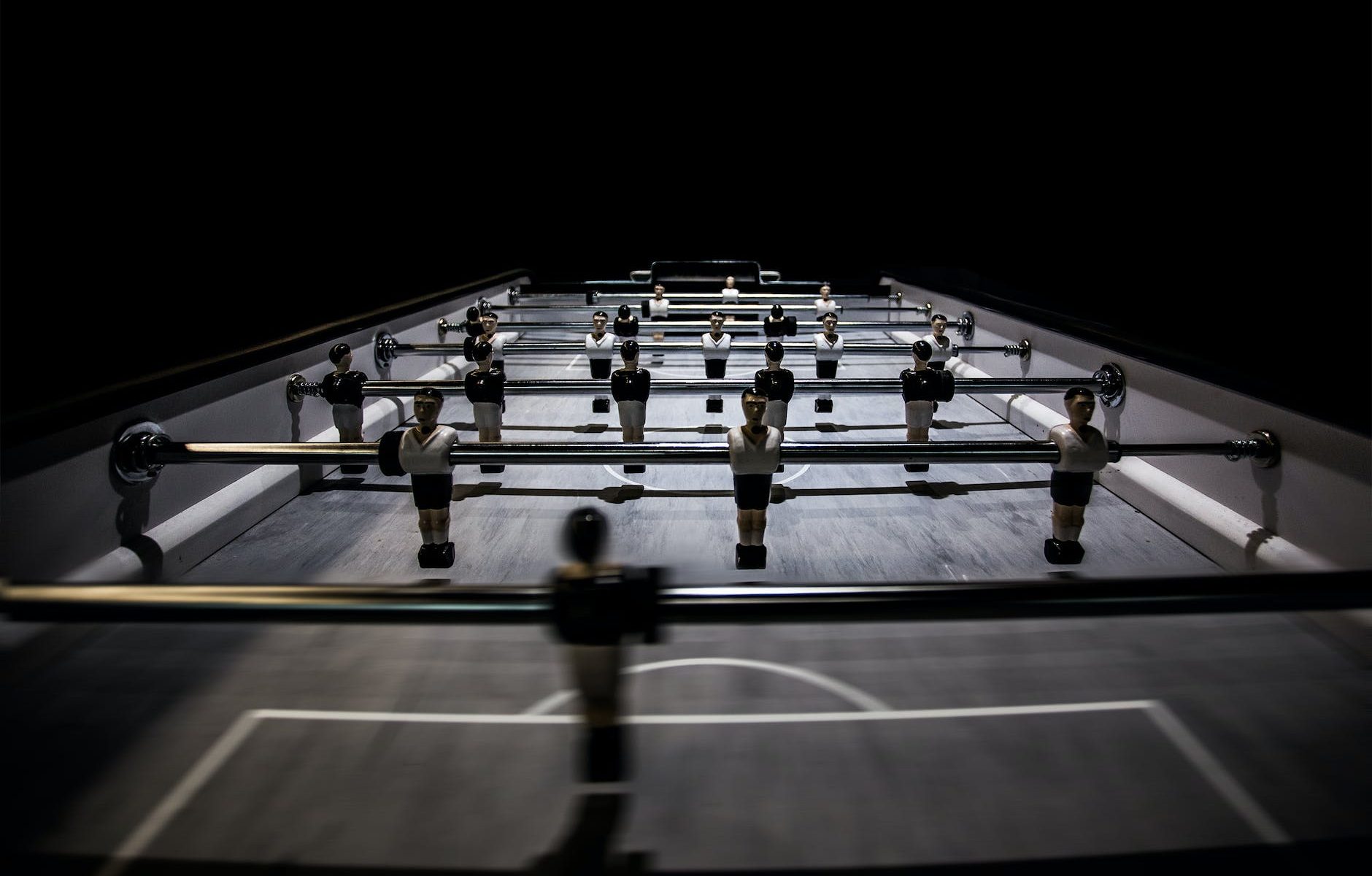 selective focus photography of foosball table